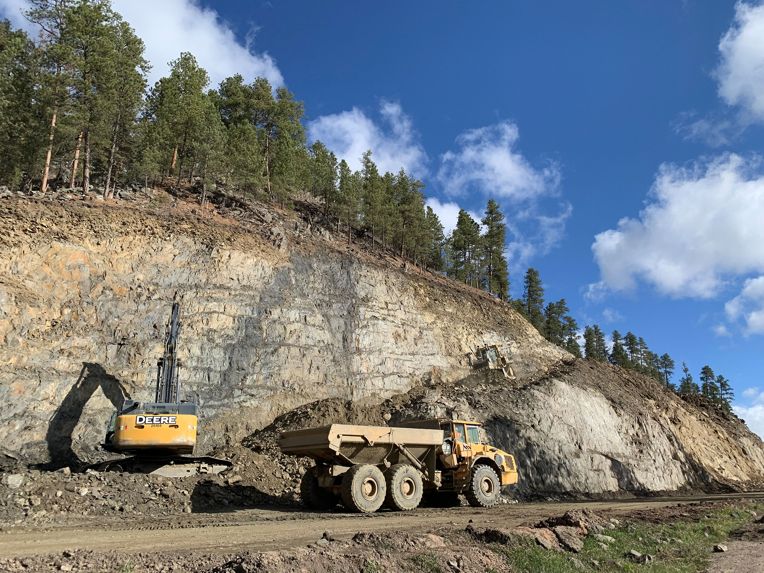 Construction equipment on side of hill.