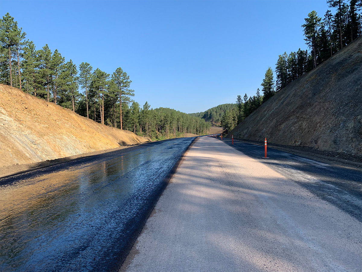 Graded roadway with orange cones.